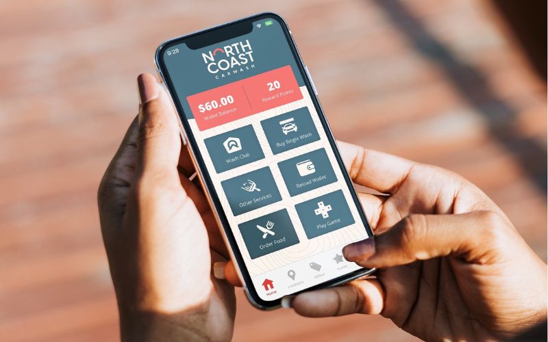 beacon_mobile_changes.jpg hands holding phone displaying car wash app