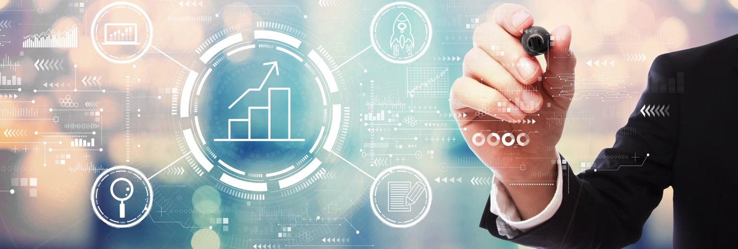 hand with marker writing on a screen where there are different business and marketing graphics