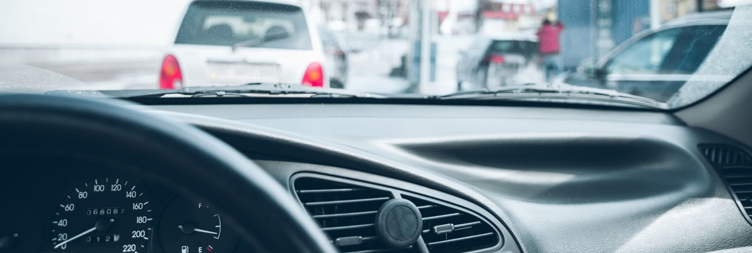 a line of cars as seen from the inside of a car that is in the line