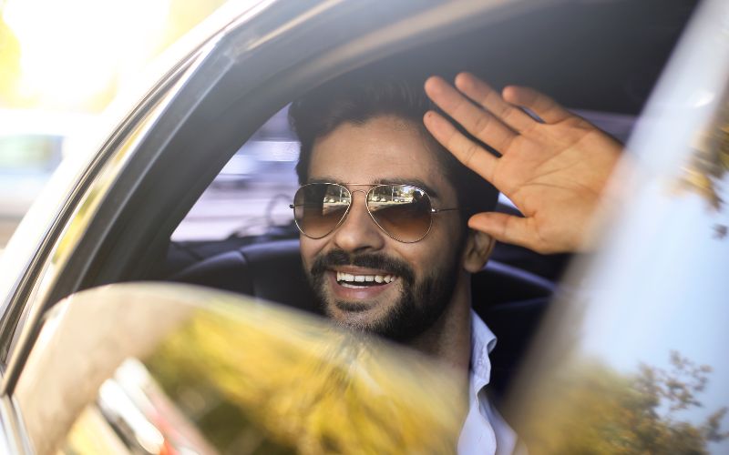 car_wash_vip.jpg important looking man waving from a vehicle