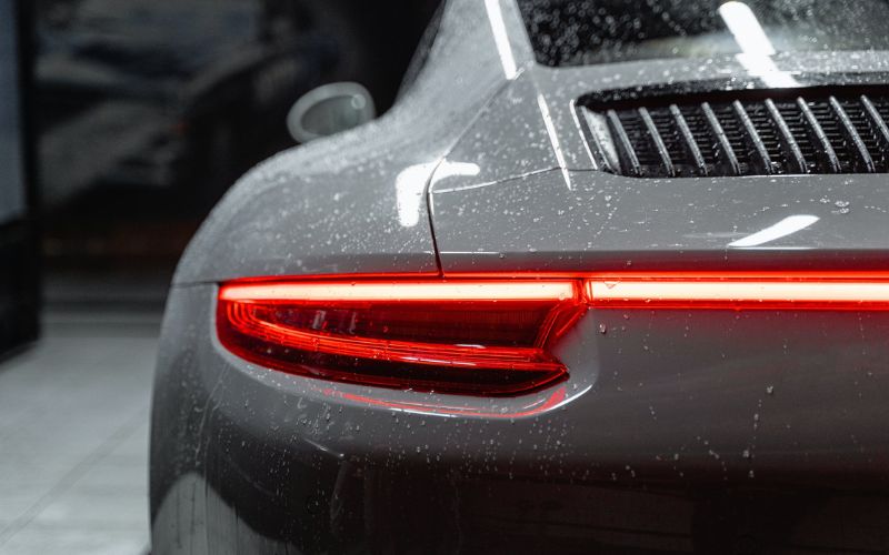 Back view of gray car with water spots 