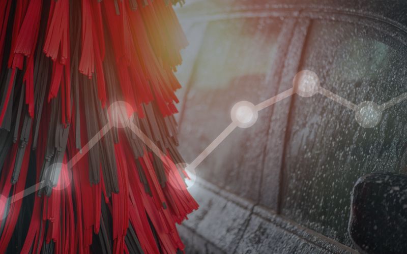 close up of a black and red wrap and car windows in an car wash with an overlayed graphic depicting data points