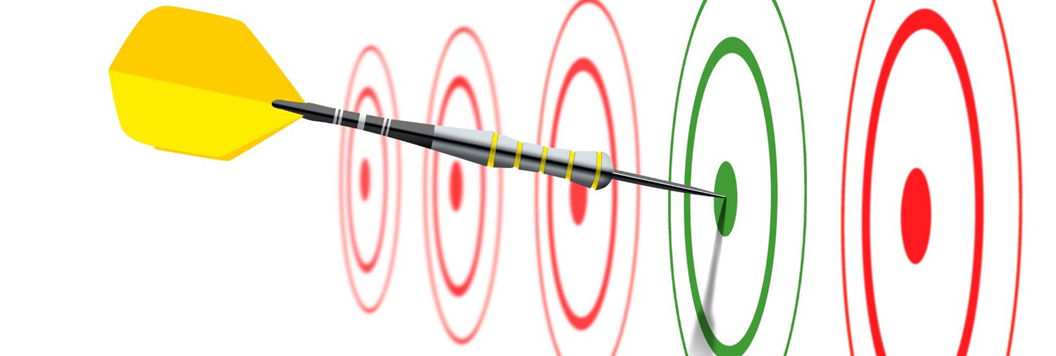 row of targets on white background with a dart in the middle of a green one