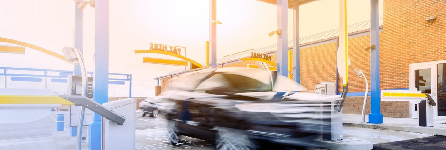 car zooming through car wash lane
