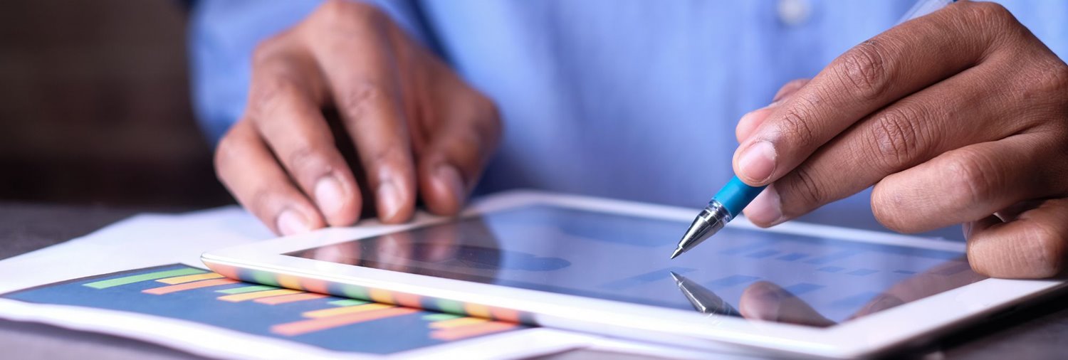 man reviewing data on a tablet