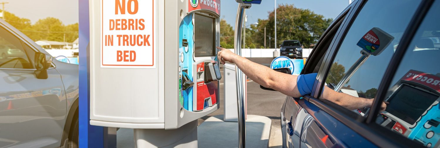car wash customer completing transaction on drb's xpt pay station
