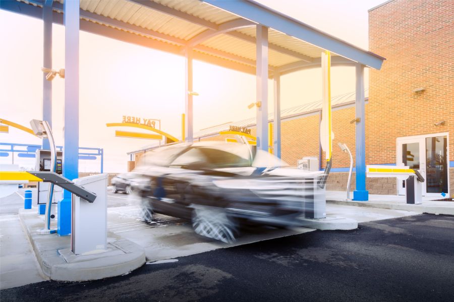 speed_up_car_wash_transactionos.png car zooming through car wash lane